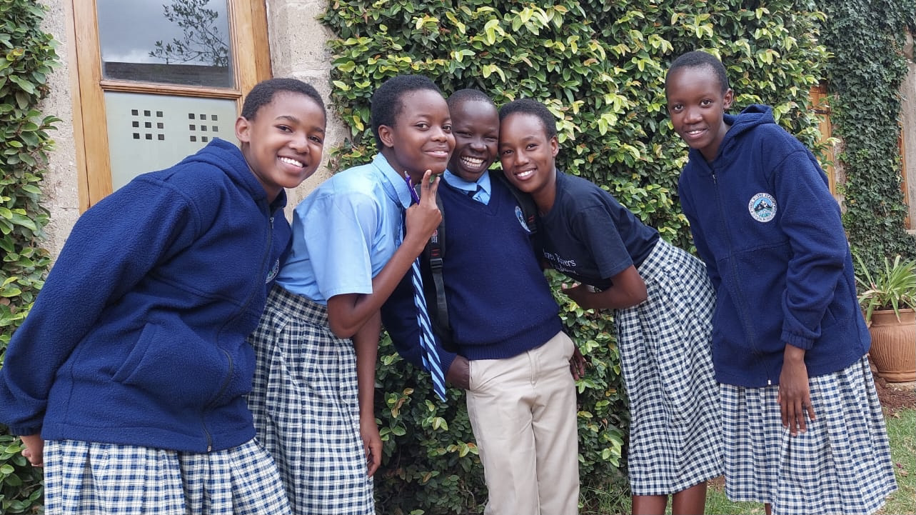 Students smiling in a classroom